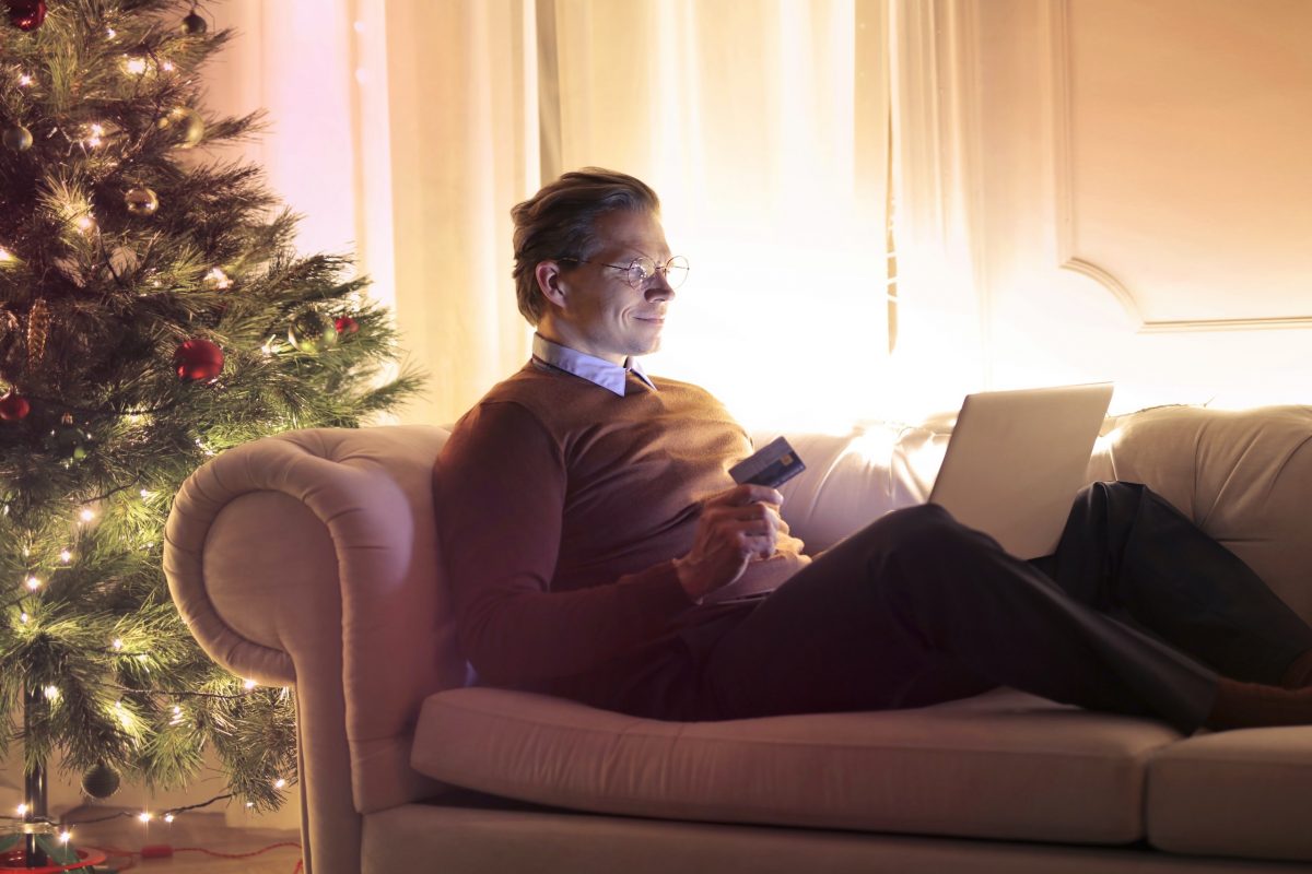 man-in-brown-long-sleeve-sweater-and-black-pants-sitting-on-3771787