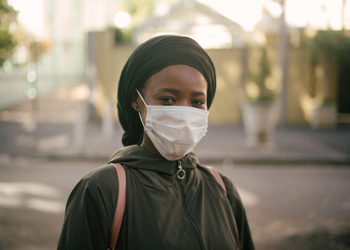 african-american-woman-in-face-mask-on-city-street-4177882